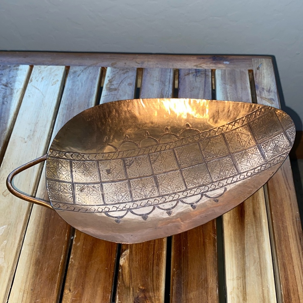 Engraved copper bowl.